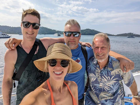 A selfie of a family on a boat