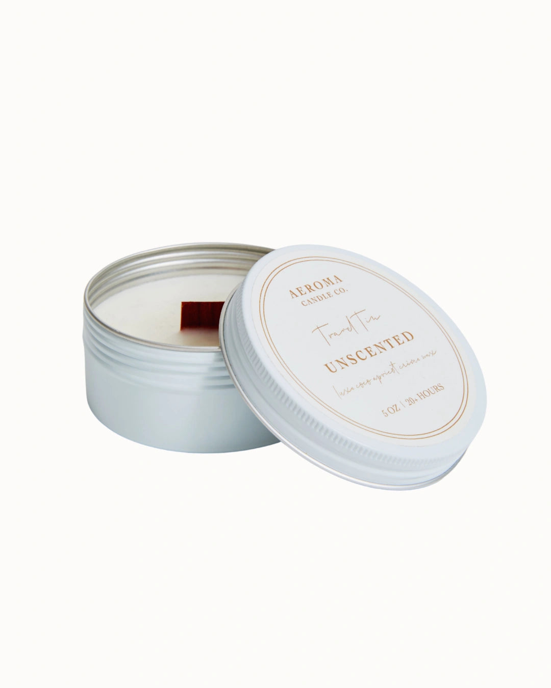 Unscented candle in a tin with a white lid on a white background