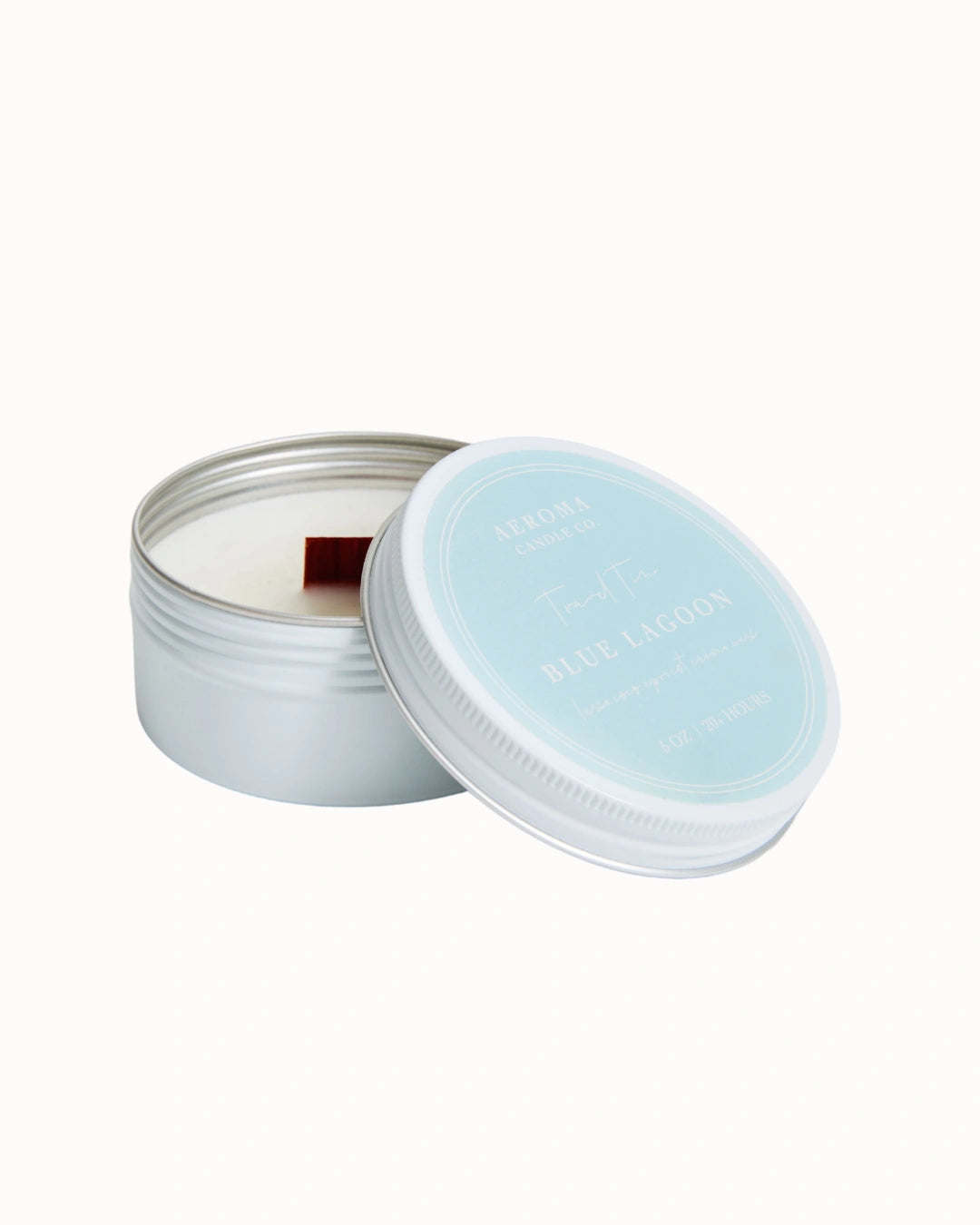 Candle in a tin with a light blue lid on a white background